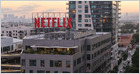 El acuerdo de Spotify para llevar podcasts de vídeo a Netflix impide que los programas se transmitan por completo en YouTube; Netflix no introducirá pausas publicitarias, pero los anuncios integrados de Spotify permanecerán (New York Times)